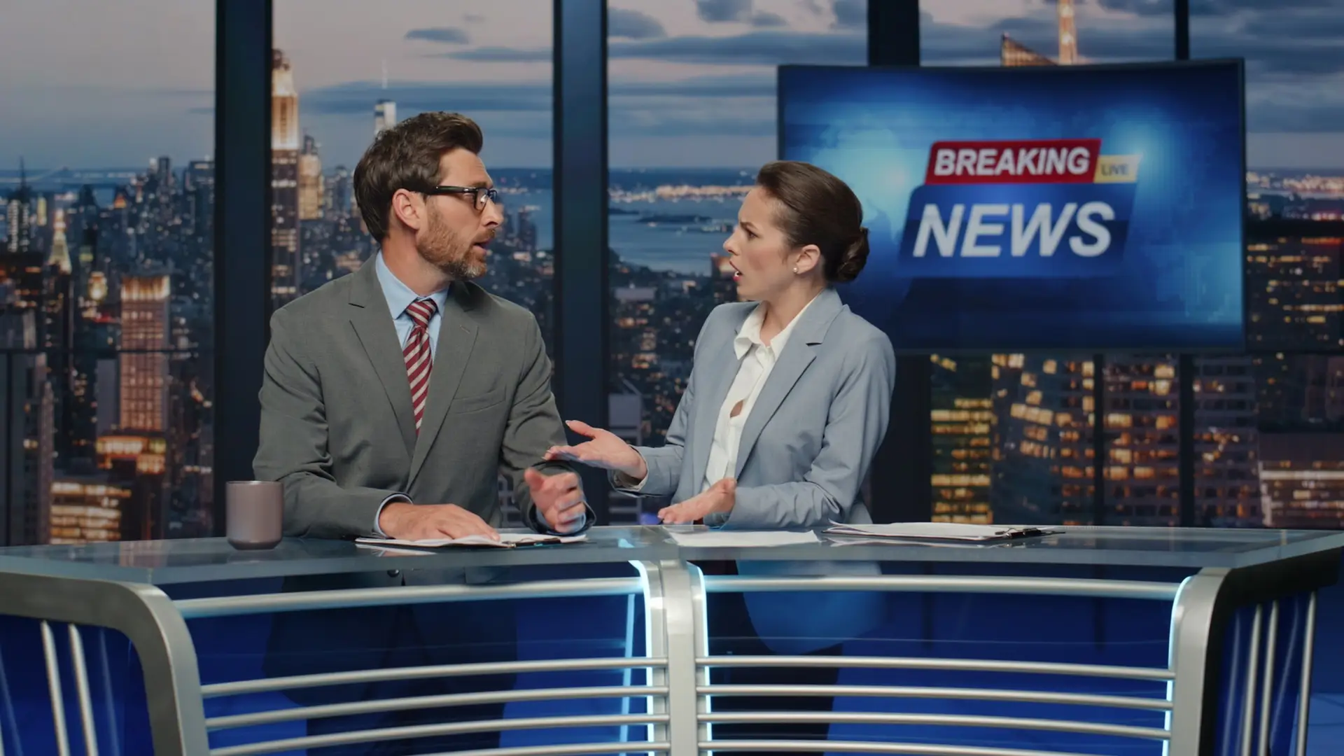 Anchors talking breaking news evening television studio closeup. Hosts speaking